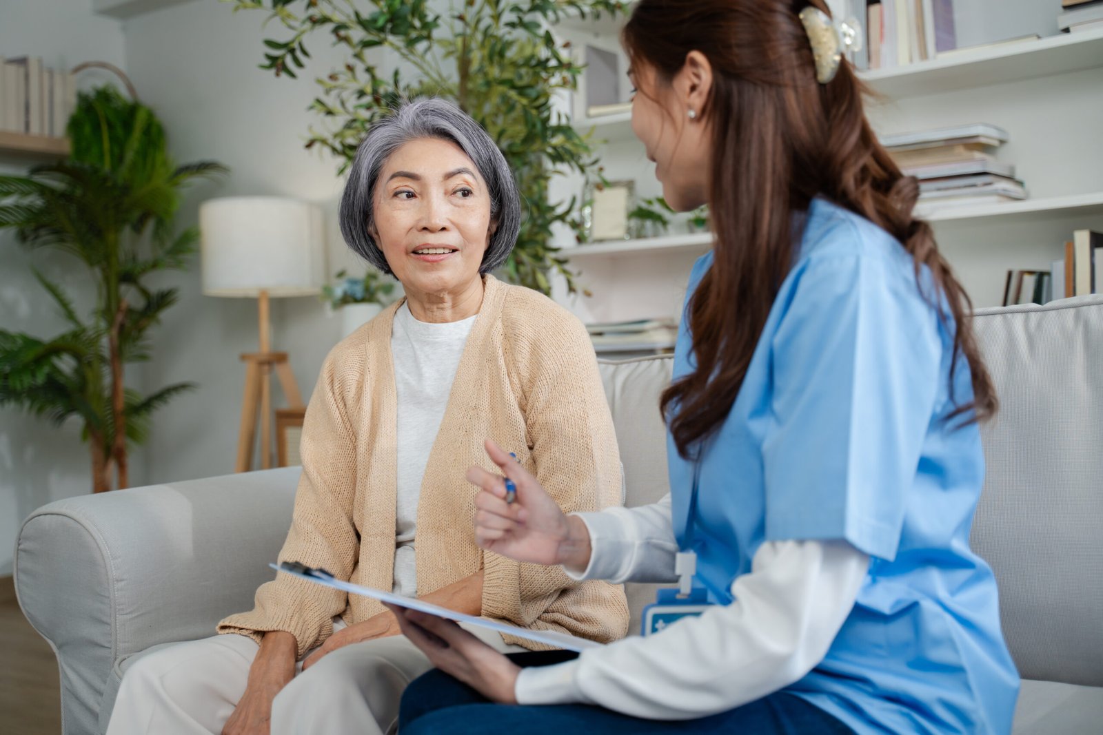 Visiting doctor speaking with a senior man in the comfort of his home